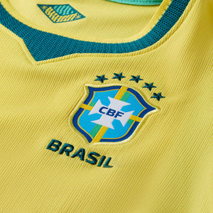NIKE JR BRAZIL WC26 HOME LB KIT CANARY/LIGHT MENTA