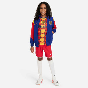 NIKE JR BARCELONA 23-24 PRE-MATCH SS TOP UNIVERSITY GOLD/MIDNIGHT NAV