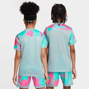 NIKE JR ACADEMY25 PLUS SS TOP HYPER PINK/OCEAN CUBE